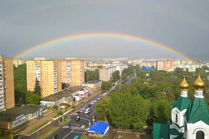 двойная радуга над городом